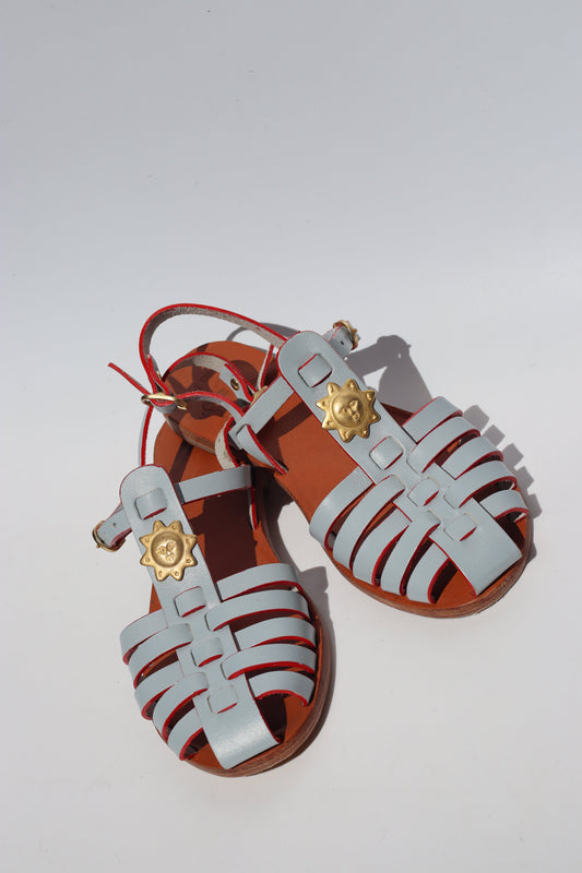 Light blue leather fisherman sandals with gold sun charm, women's flat caged toe sandals Lisbon