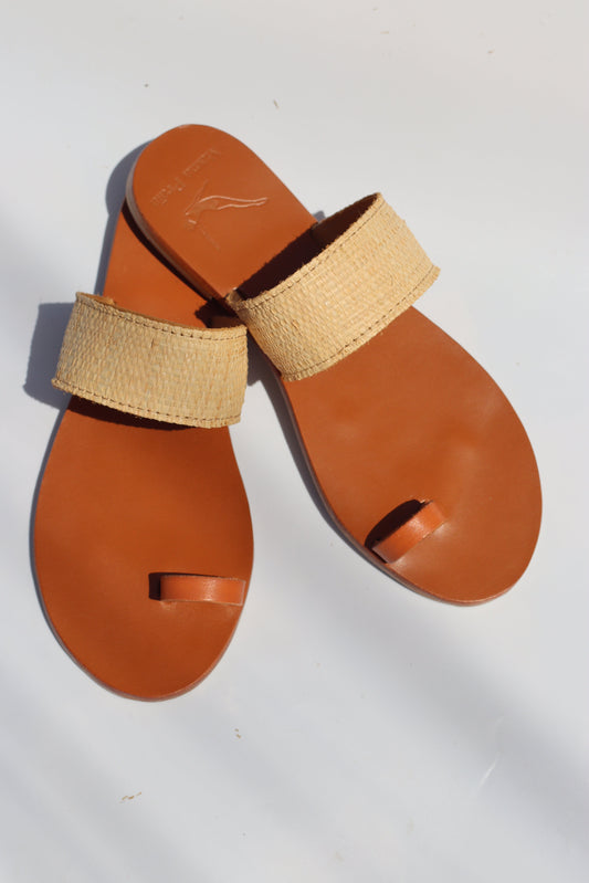 Studio photo of Leather sandals in raffia