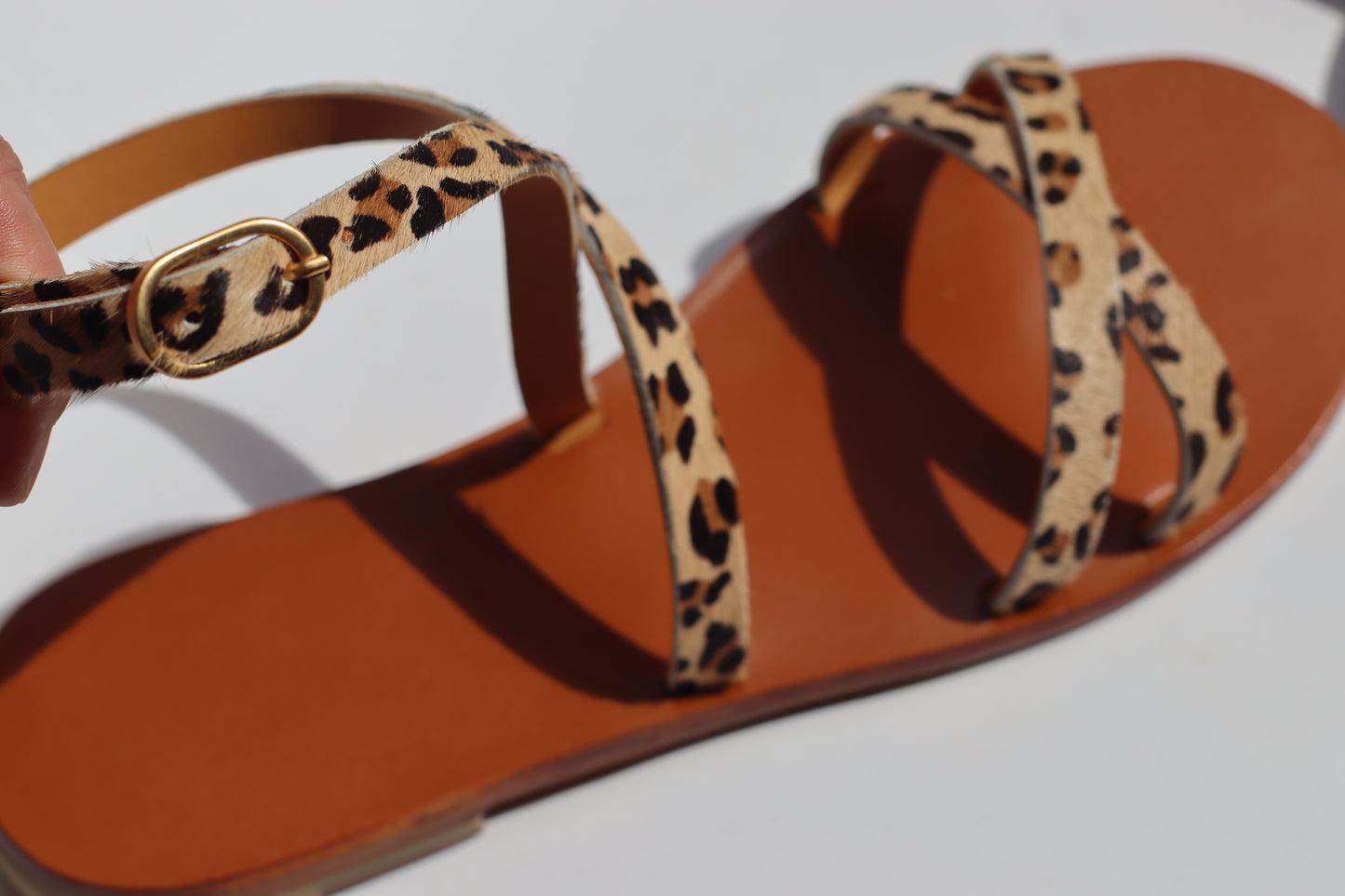 fopcus on the buckel of the sandal
