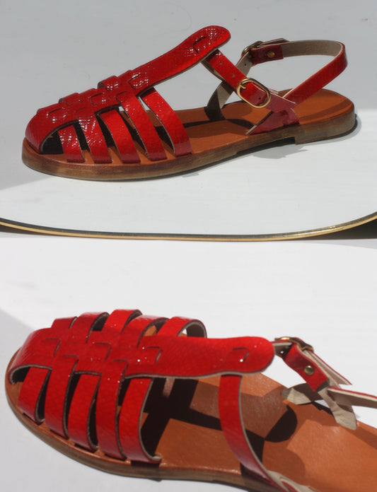 Zoom on a miror of a red fisherman sandals
